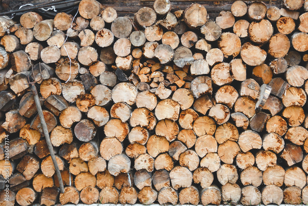 Pile of wood stock ready for winter in village Pile of wood stock ready for winter in village
