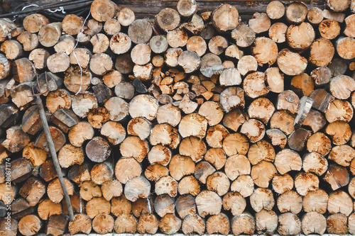 Pile of wood stock ready for winter in village