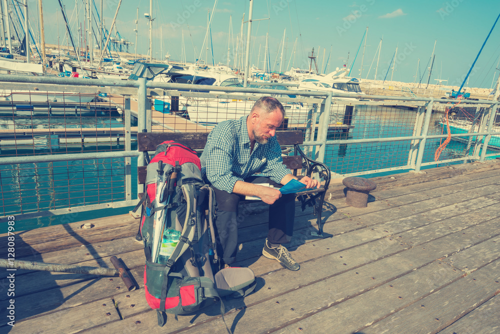 Bearded man, traveler at the yacht club