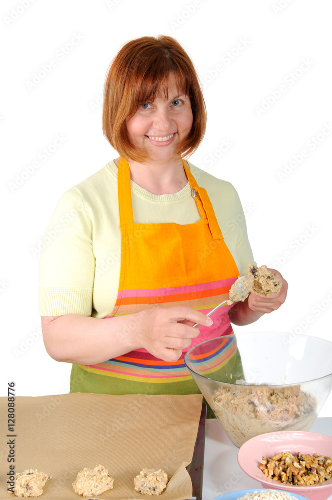 Portrait of pretty middle-aged woman, who makes biscuits..