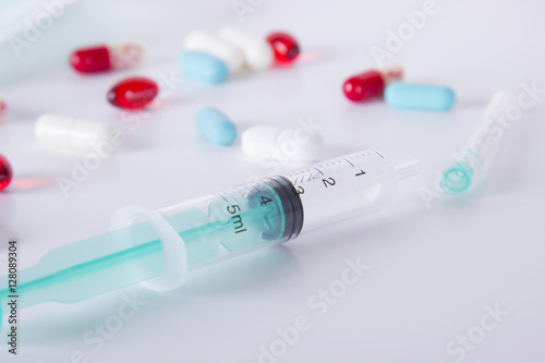 syringe and pill
