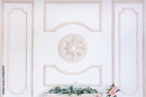 antique stucco molding on a wall. Classical elements in an interior. Light room