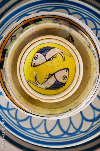 Ceramic plates with fishes, yellow and blue. Old