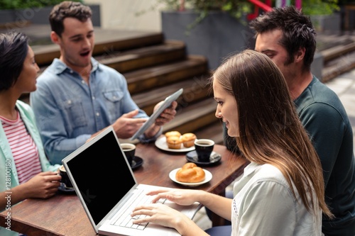 Smiling woman using laptop