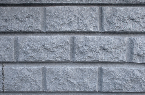 Artificial medieval grey brick wall texture