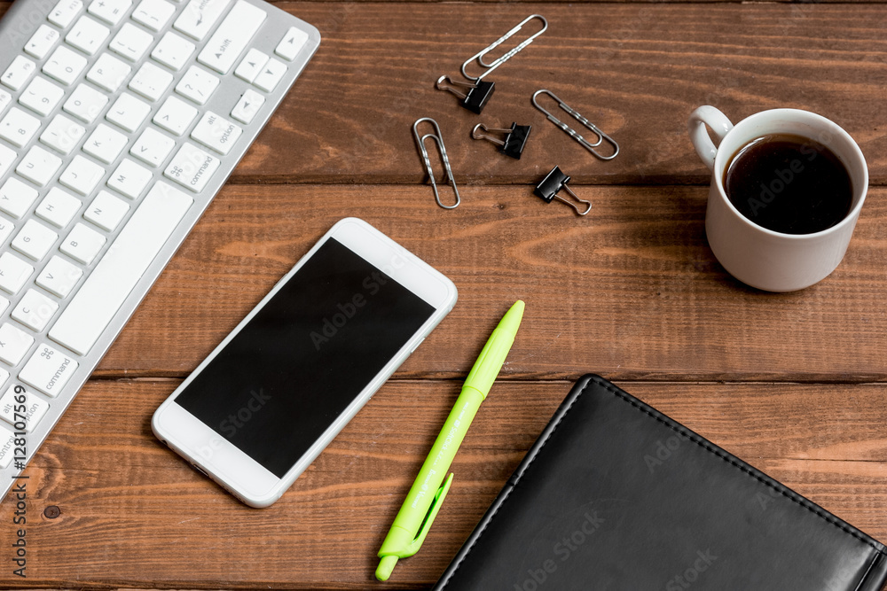 mans working place at wooden desktop with coffee mans working place at wooden desktop with coffee