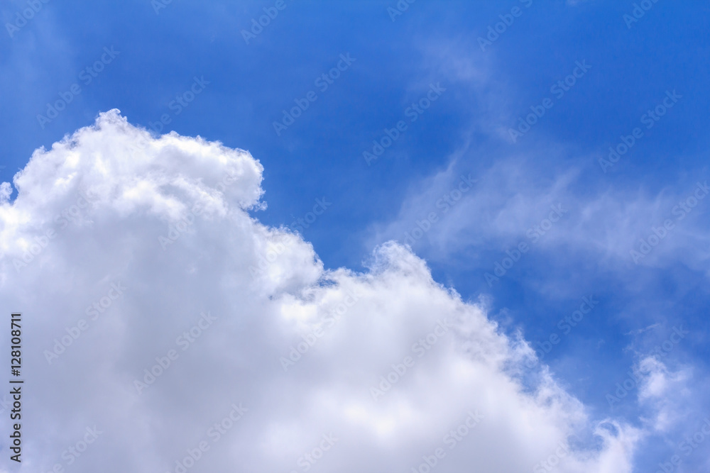 Blue sky background with white clouds. The vast blue sky and clouds sky on sunny day. White fluffy clouds in the blue sky.