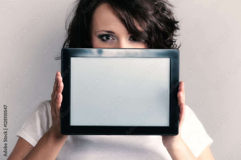 Sexy girl showing copy space on tablet touchpad Sexy girl showing copy space on tablet touchpad