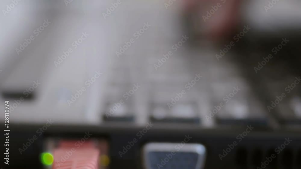 Close up of business man hand working on laptop computer in office as concept with defocus effect shot Close up of business man hand working on laptop computer in office as concept with defocus effect shot