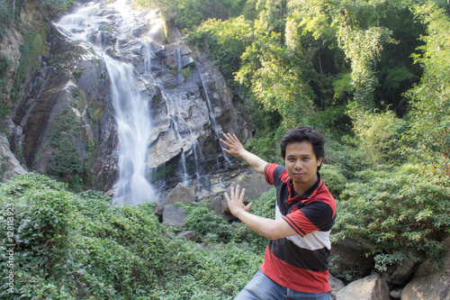 Thai man with Mae Tia Waterfall, Obluang National Park, Chiangmai photo