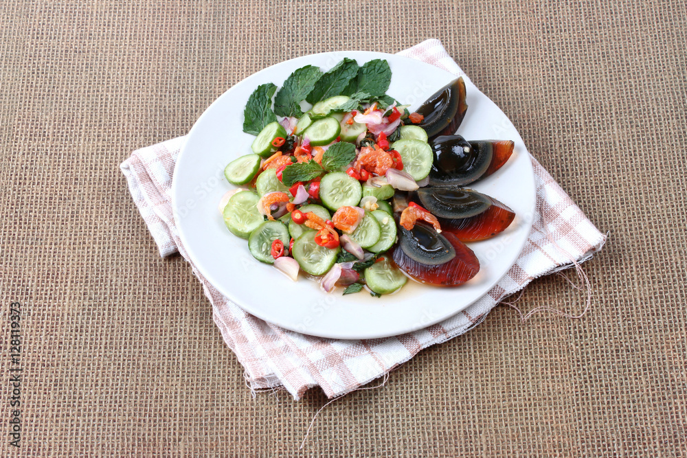 Spicy cucumber salad with dried shrimp and preserved egg. Spicy cucumber salad with dried shrimp and preserved egg.