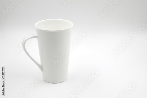 white cup on white background with copy space on right