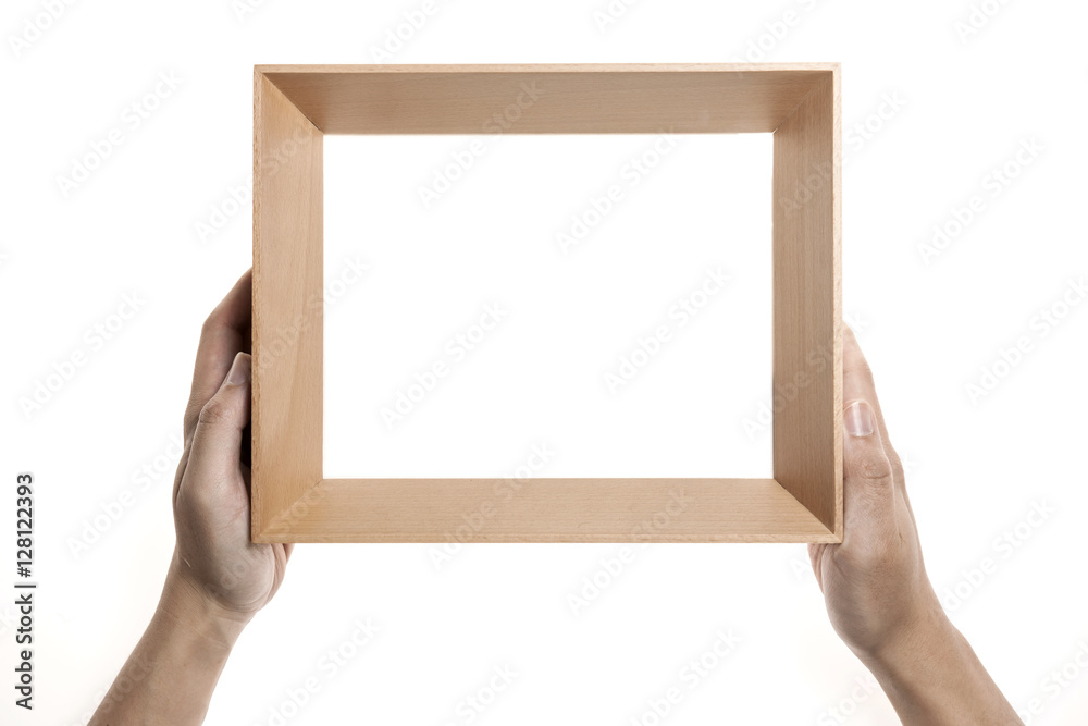 Two hands hold a photo(picture) wood frame isolated white. Two hands hold a photo(picture) wood frame isolated white.