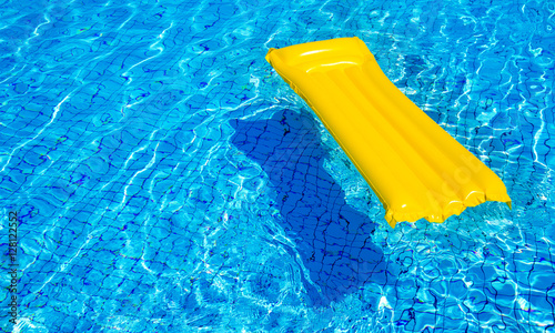 Orange mattress in a pool