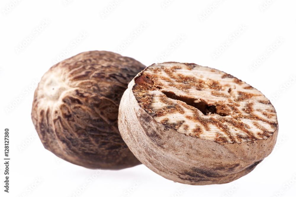 Nutmeg , half and ground on white background Nutmeg , half and ground on white background
