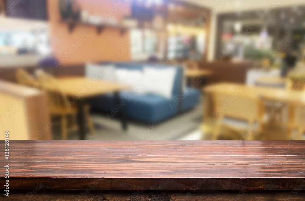 Selected focus empty brown wooden table and Coffee shop or restu Selected focus empty brown wooden table and Coffee shop or restu