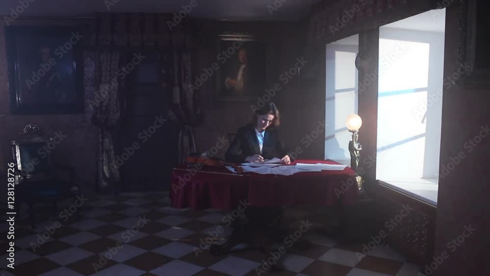 Woman Sitting At A Table In A Room Of Old And Works During An Electrical Storm Woman Sitting At A Table In A Room Of Old And Works During An Electrical Storm