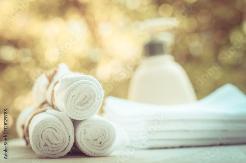 Rolled up white spa towels, selective focus, vintage