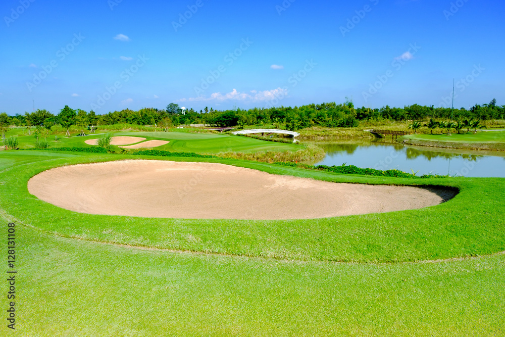 green golf field and blue cloud sky for backdrop background use