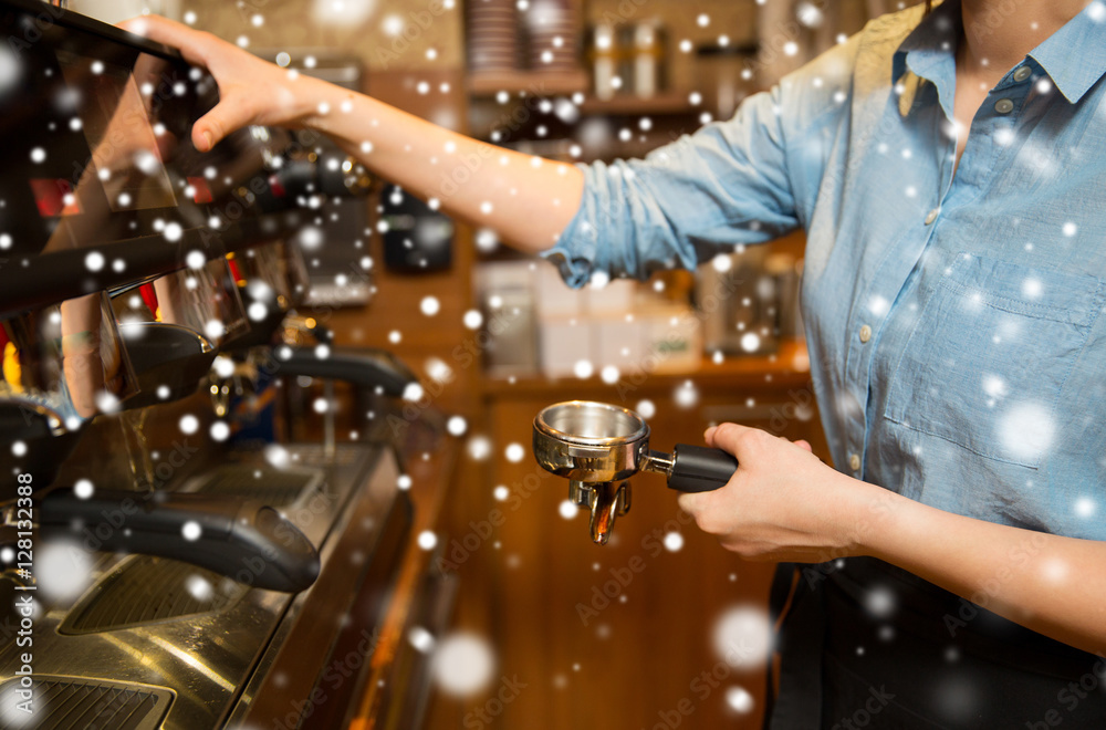 Naklejka premium close up of woman making coffee by machine at cafe