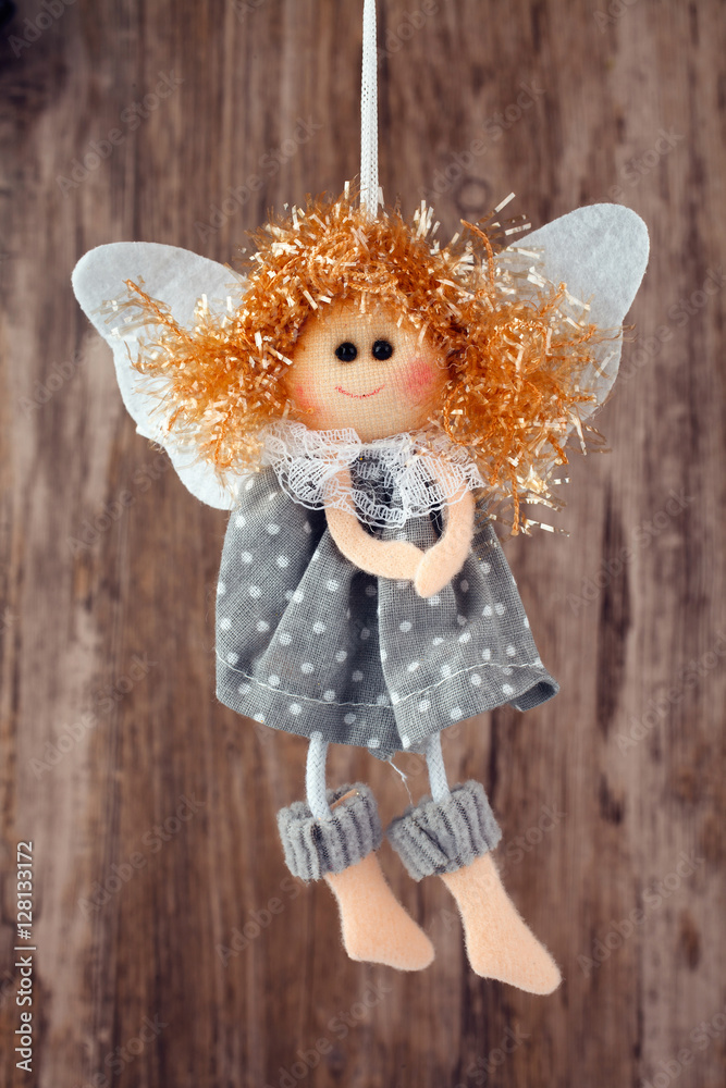 Fototapeta premium vintage toy angel figurine on wooden table