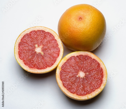 Grapefruit, whole and sliced in two. 