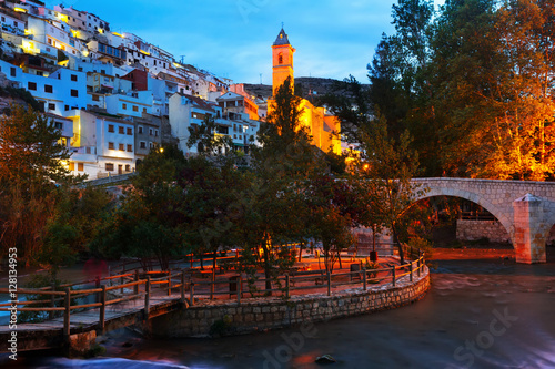 twilight view of Alcala del Jucar with river