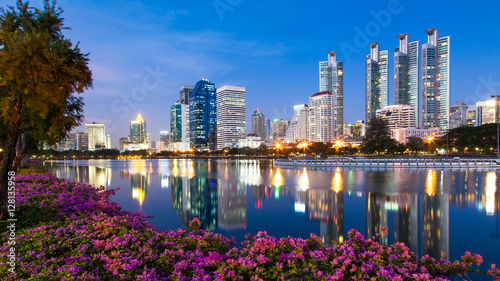 Light in the city, beautiful view, flowers foreground and reflection, Bangkok, Thailand