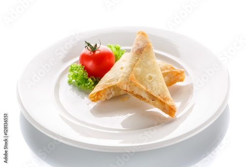 pancakes fried with tomatoes on a white background