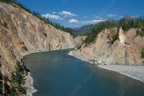 The view from the mountain slope to the river with green water. River Omulevka, Magadan Oblast, Russia. photo