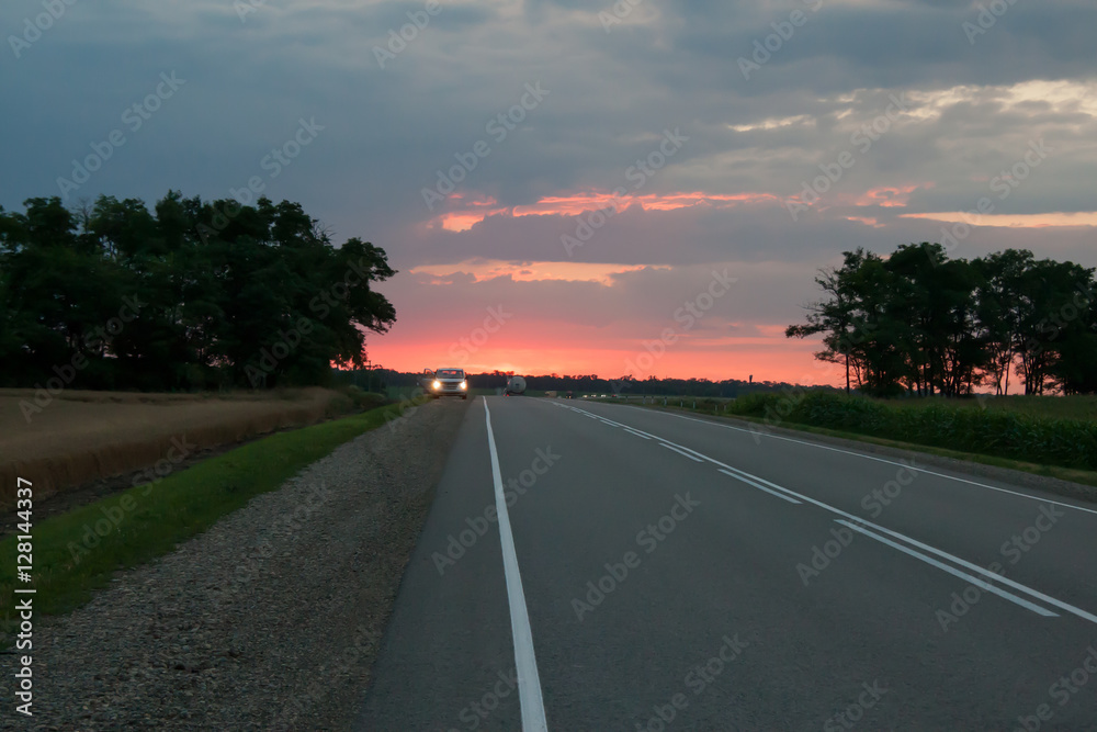 country asphalt road in the evening