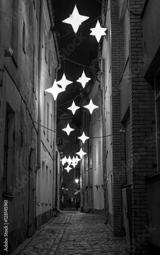 Narrow street with stars at night