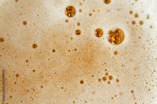 Close up image of beer bubbles.