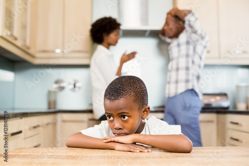 Photography Sad boy against parents arguing
