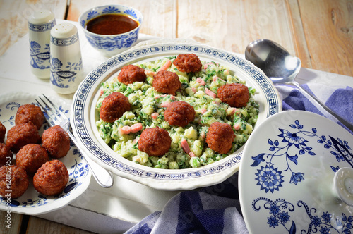Kale and mashed potato meal with meatballs. Traditional Dutch winter meal. Stamppot. photo