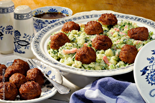 Kale and mashed potato meal with meatballs. Traditional Dutch winter meal. Stamppot. photo