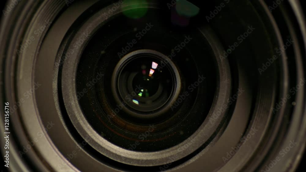 Camera lens zoom. Changing focal length. Front view macro shot.