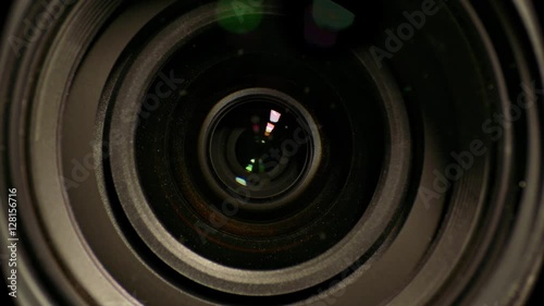 Camera lens zoom. Changing focal length. Front view macro shot.