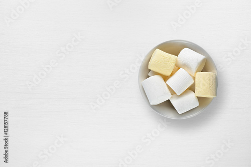 Marshmallow in bowl on white table top view