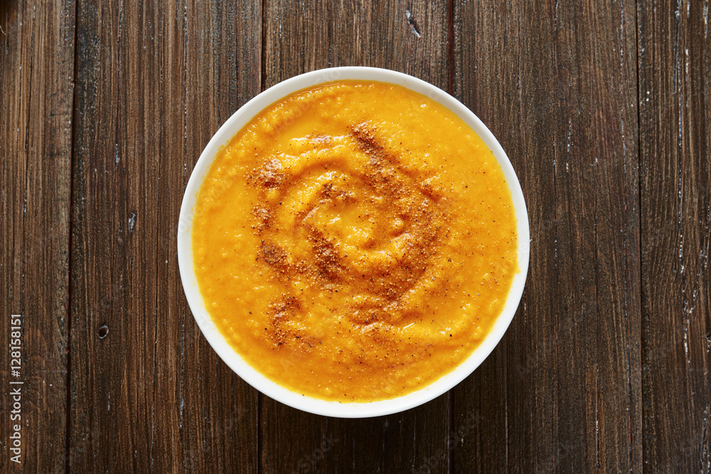 Pumpkin soup in white bowl Pumpkin soup in white bowl