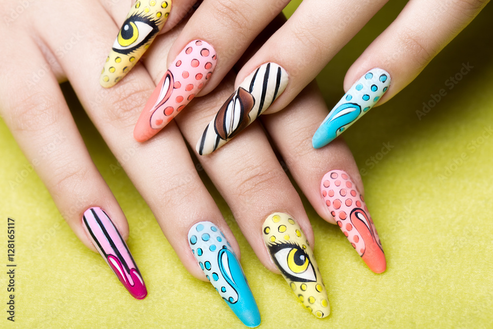 Long beautiful manicure in pop-art style on female fingers. Nails design.  Close-up. Stock Photo | Adobe Stock