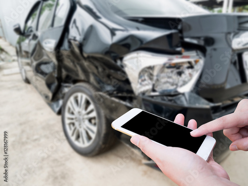Canvas Print Female using mobile phone after car accident