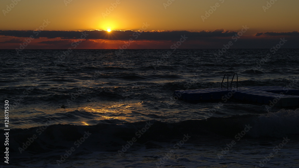 A perfect sunrise over an agitated sea
