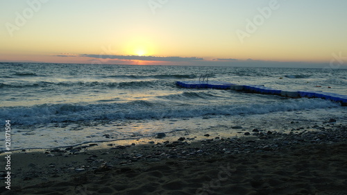 A perfect sunrise over an agitated sea