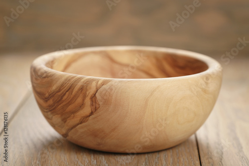 Принти на полотні empty olive wood bowl on wooden table, shallow focus