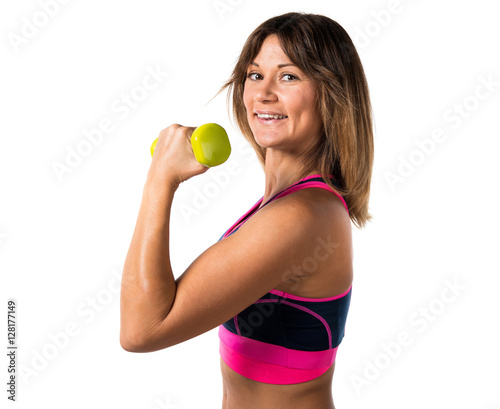 Sport woman making weightlifting © luismolinero