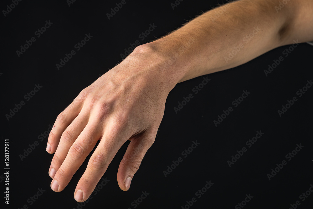 Fototapeta premium human hand showing signs. isolated on black