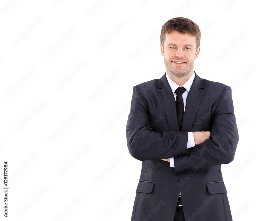 Portrait of a handsome business man  in suit smiling with arms  