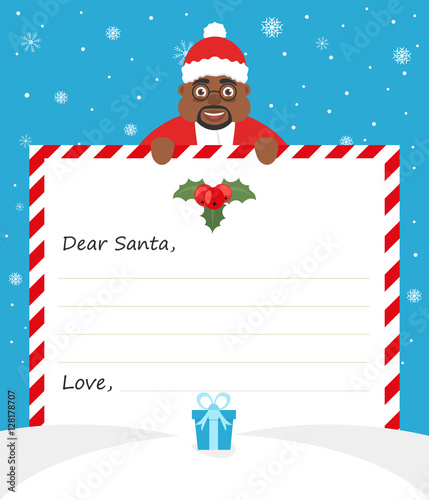 Handsome African American Santa in uniform suit is holding a paper and smiling friendly. Merry Christmas and Happy New Year.