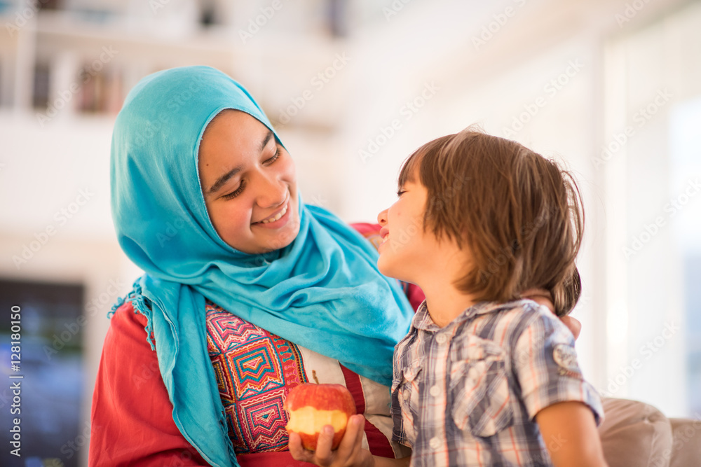 Young woman with little kid at home Young woman with little kid at home